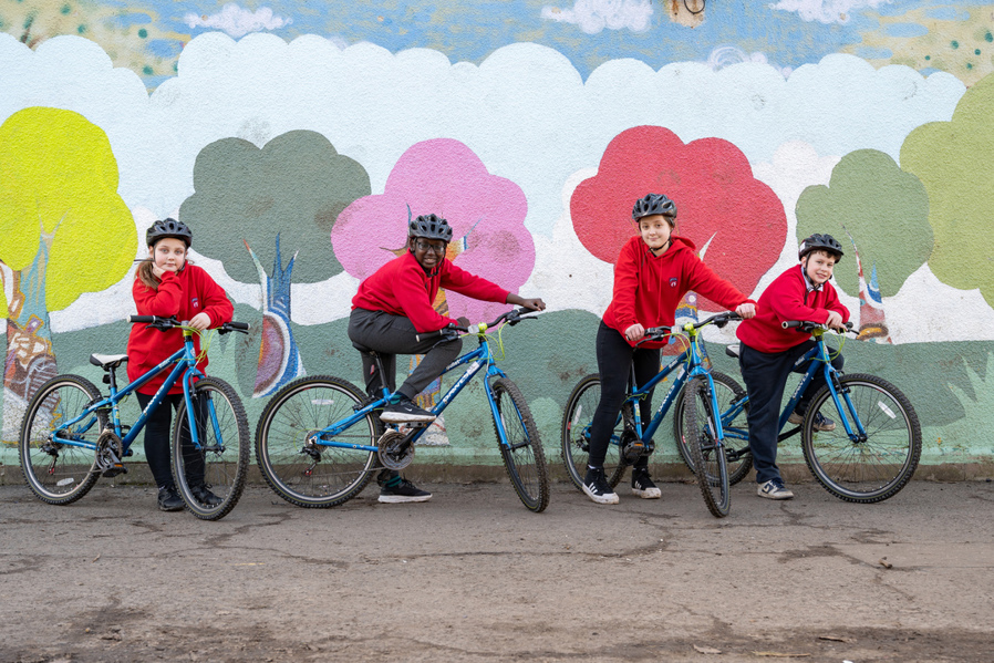 The pupils of Ferryhill Primary School with their bikes in the school playground