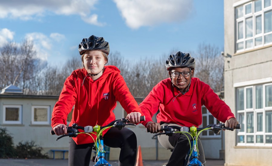 Kennedi and Abdoulie with their bikes