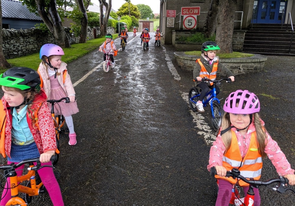Children at Papdale Nursery in Orkney ride their bikes during a Play on Pedals session