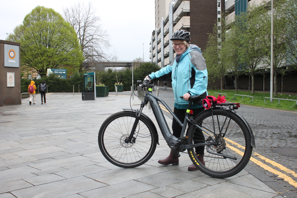 Helena, pictured with her bike outside SPT's Cowcaddens Subway station, on the way to work