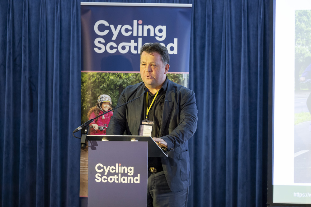 Brian Deegan, Director of Inspections at Active Travel England, addresses the 2025 Cycling Scotland Conference in Dundee