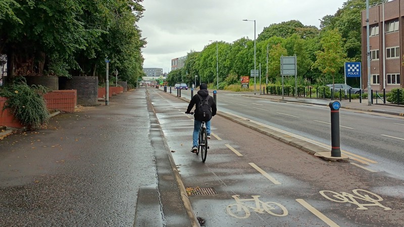 A person cycles along Glasgow's East City Way protected cycle route