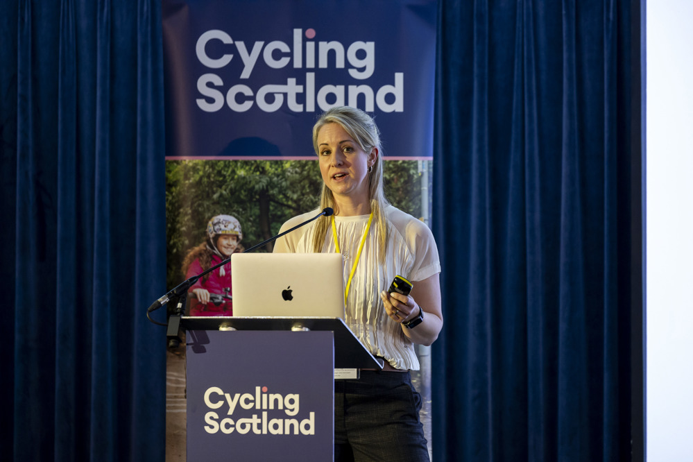 Rebecca Morris, Vision Zero Communications Director and road safety campaigner addresses the 2025 Cycling Scotland Conference in Dundee