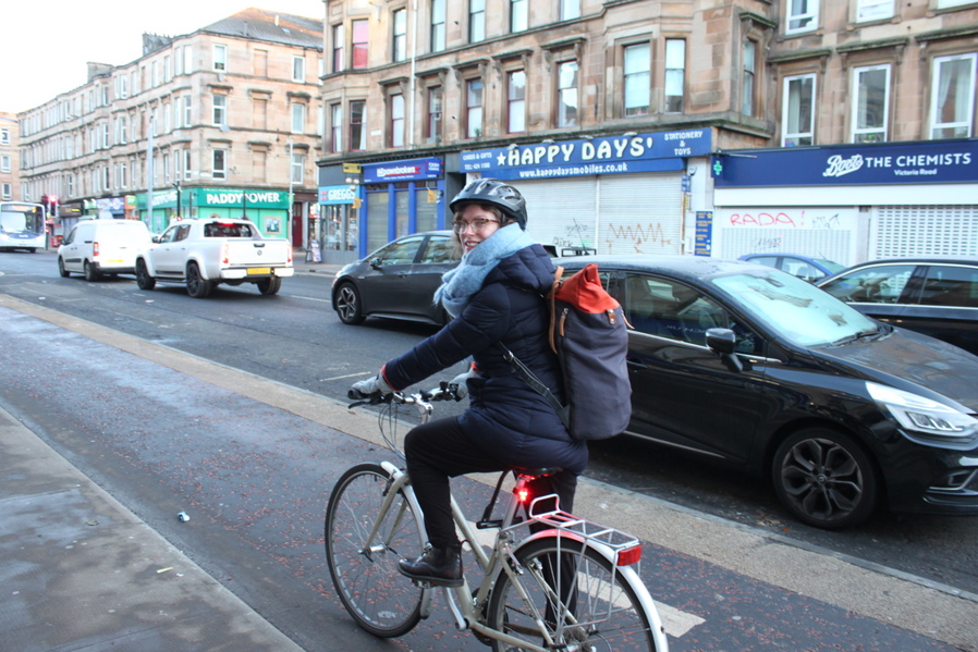 Jen, a regular cycle commuter, with her bike on the South City Way cycle route in the south side of Glasgow