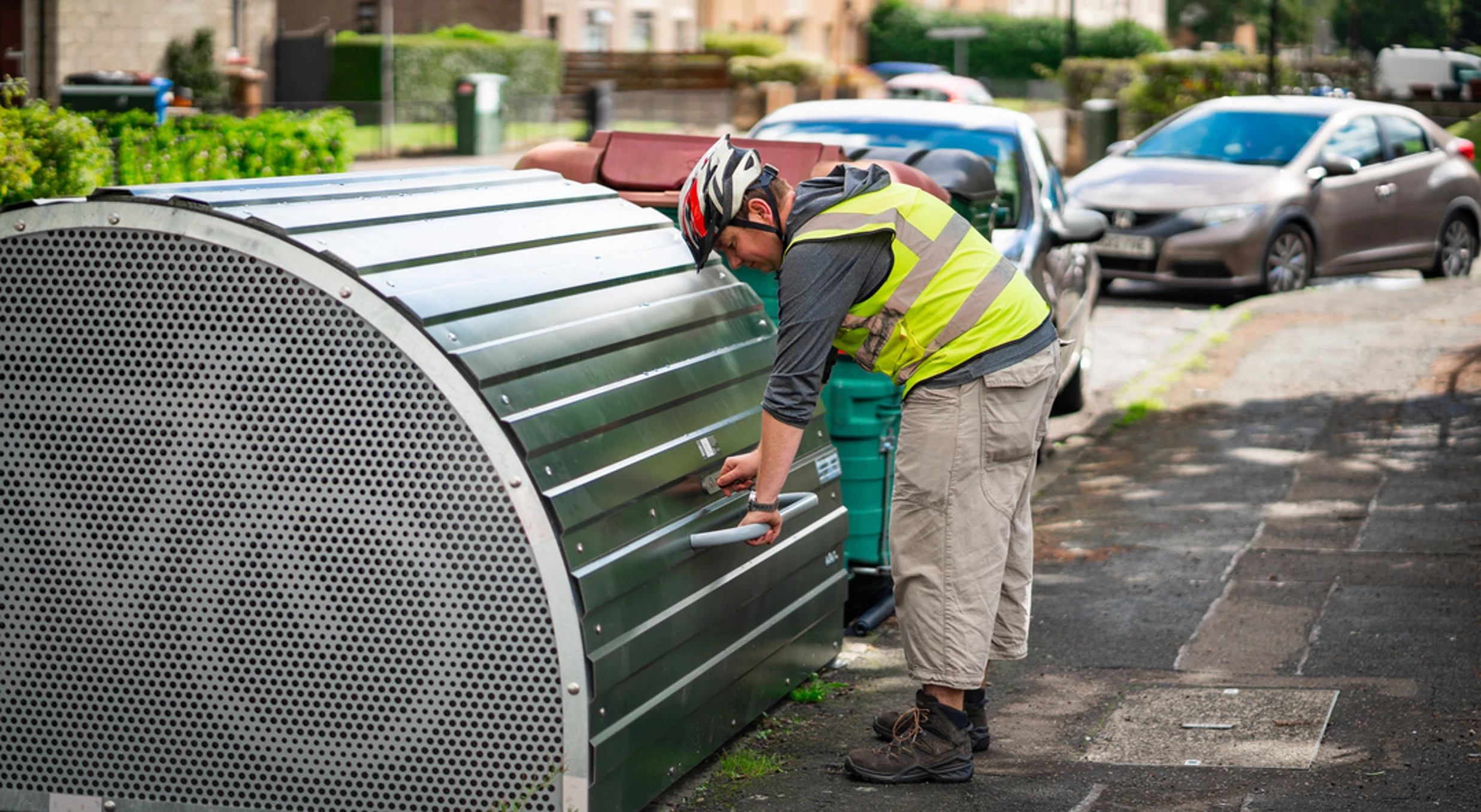 Man using on-street bike locker