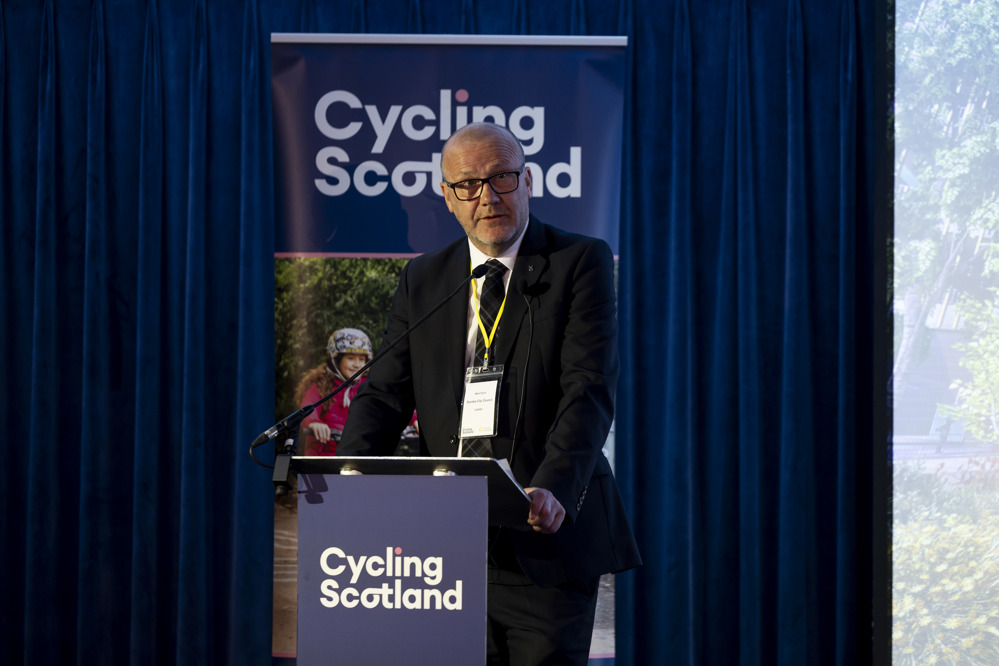 Councillor Mark Flynn, Leader of Dundee City Council, addresses the 2025 Cycling Scotland Conference