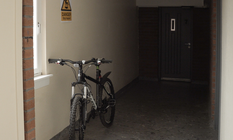 Photo of a bike parked in a communal hallway